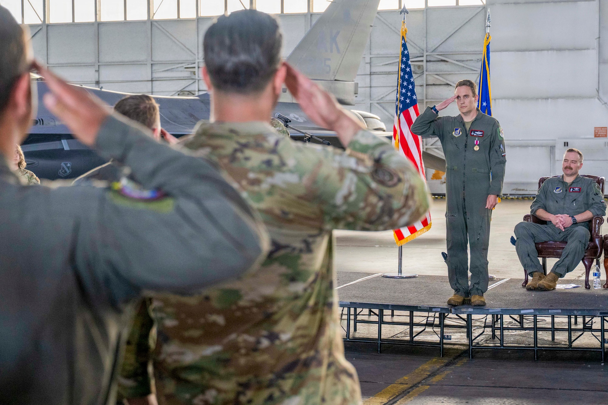U.S. Lt. Col. Eric Hakos, 353rd Combat Training Squadron commander, renders his final salute to members of the 353rd CTS during a change of command ceremony at Eielson Air Force Base, Alaska, June 26, 2026.