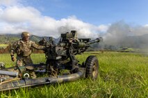 U.S. Army Spc. Desmond Harris and Pfc. Kayla Callahan, assigned to Bravo Battery, 3rd Battalion, 7th Field Artillery Regiment, 25th Division Artillery, 25th Infantry Division, fire an M119A3 howitzer during live-fire training at Schofield Barracks, Hawaii, June 30, 2026.