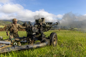 U.S. Army Spc. Desmond Harris and Pfc. Kayla Callahan, assigned to Bravo Battery, 3rd Battalion, 7th Field Artillery Regiment, 25th Division Artillery, 25th Infantry Division, fire an M119A3 howitzer during live-fire training at Schofield Barracks, Hawaii, June 30, 2026.