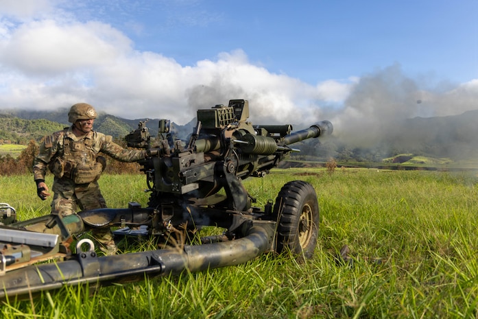 U.S. Army Spc. Desmond Harris and Pfc. Kayla Callahan, assigned to Bravo Battery, 3rd Battalion, 7th Field Artillery Regiment, 25th Division Artillery, 25th Infantry Division, fire an M119A3 howitzer during live-fire training at Schofield Barracks, Hawaii, June 30, 2026.