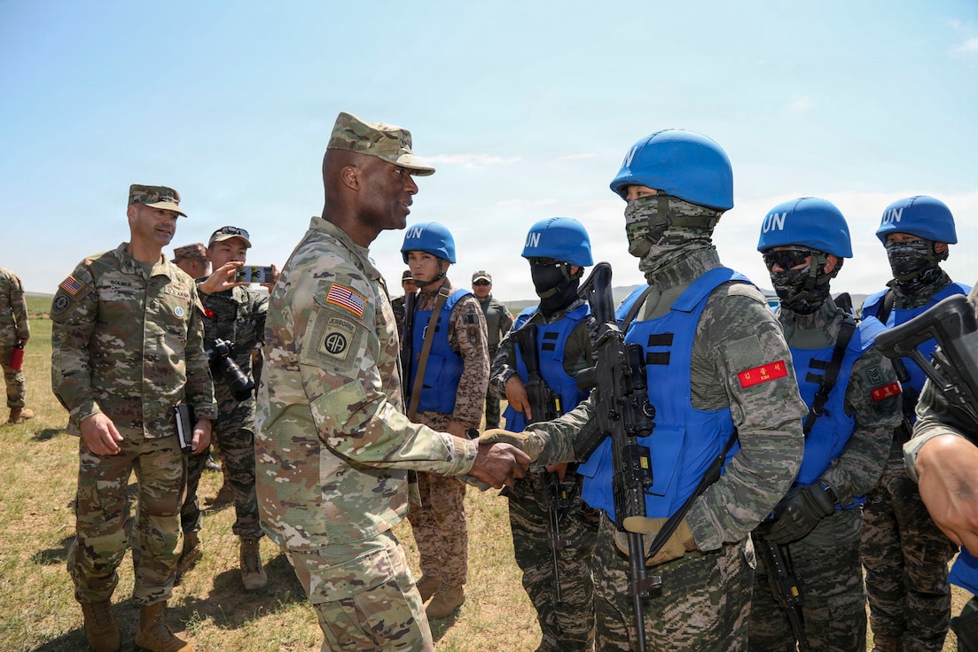 Gen. Xavier T. Brunson, commander of UNC/CFC/USFK, speaks with ROK Marines during exercise Khaan Quest 2026 to emphasize alliance interoperability.