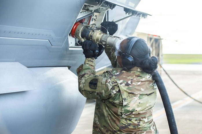 U.S. Army Reserve Sgt. Soonafai Seloti, Forward Support Company 411th Engineer Battalion, 303rd Maneuver Enhancement Brigade, 9th Mission Support Command, connects the fuel hose of a U.S. Army Heavy Expanded Mobility Tactical Truck to refuel a U.S. Air Force F-35 Lightning II, 4th Expeditionary Fighter Squadron, June 22, 2026, at Anderson Air Force Base, Guam, as part of exercise Valiant Shield 2026.