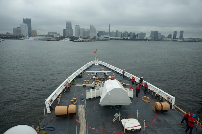 Crew members assigned to Legend-class cutter USCGC Midgett (WMSL 757) prepare the forecastle for mooring operations in Yokohama, Japan, during Pacific Atlas, June 18, 2026.