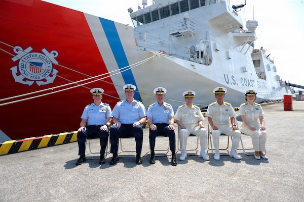 From left to right, U.S. Coast Guard Cmdr. Keith Wilkins, the U.S. Coast Guard Attaché to Japan; U.S. Coast Guard Capt. Brian Whisler, commanding officer of Legend-class cutter USCGC Midgett (WMSL 757); U.S. Coast Guard Vice Adm. Joseph Buzzella, commander, Pacific Area; Japan Coast Guard Vice Commandant for Operations, Hiroaki Kanosue; Japan Coast Guard Superintendent, 1st-Grade Takuya Fukumoto, commander of the 3rd Regional Coast Guard Headquarters; and Japan Coast Guard Rear Adm. Hisako Nakabayashi, commander of the Yokohama Coast Guard Office; pose in front of Legend-class cutter USCGC Midgett (WMSL 757) after a welcoming ceremony in Yokohama, Japan, June 19, 2026.