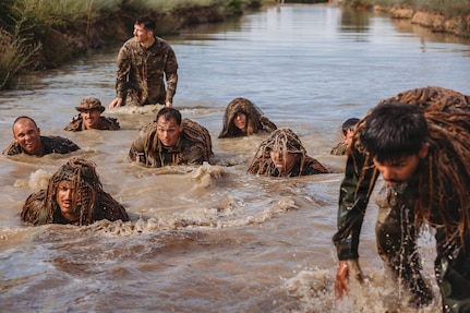 U.S. Army Soldiers with the Recon Section of the Multi-Purpose Company, 1st Battalion, 112th Infantry Regiment, 56th Mobile Brigade Combat Team, 28th Infantry Division conduct a ghillie wash training event June 25, 2026, at Fort Indiantown Gap, Pennsylvania. (U.S. Army National Guard photo by Staff Sgt. Jonathan Campbell)