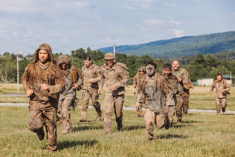 U.S. Army Soldiers with the Recon Section of the Multi-Purpose Company, 1st Battalion, 112th Infantry Regiment, 56th Mobile Brigade Combat Team, 28th Infantry Division conduct a ghillie wash training event June 25, 2026, at Fort Indiantown Gap, Pennsylvania. (U.S. Army National Guard photo by Staff Sgt. Jonathan Campbell)