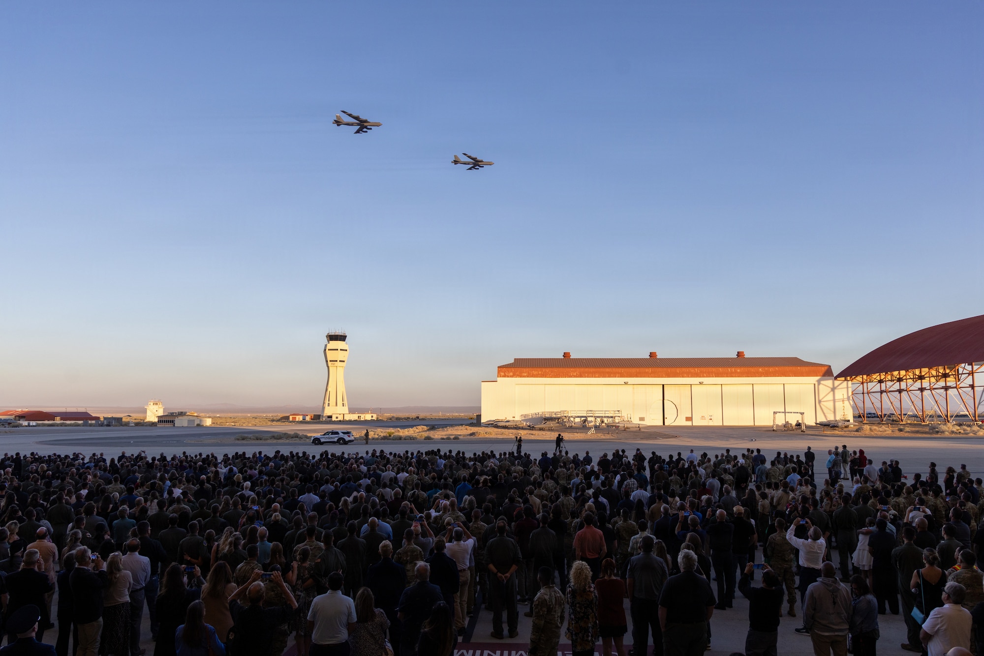 Two B-52H Stratofortress aircraft based out of Minot Air Force Base, North Dakota, and Barksdale AFB, Louisiana, fly over the Edwards AFB airfield at the conclusion of a memorial service held on June 29, 2026, at Edwards Air Force Base, California. The June 15 crash claimed the lives of Col. Gregory “Evil” Watson, Lt. Col. Gabriel “Journee” Estrella, retired Lt. Col. Miles “Vicky” Middleton, Maj. Alexander “SMO” Davis, Maj. Robert “Bolton” Dee, Maj. Brad “Slate” Hovey, Jeromy “Bobby” Smith and Christopher “Hustler” Rischar. The aircraft crashed shortly after takeoff during a routine test mission. The cause remains under investigation. The memorial service brought together the families of the fallen, members of Team Edwards, local civic leaders and senior Air Force officials. (Air Force photo by Kyle Brasier)