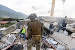 A Marine helps conduct a search and rescue operation with Venezuelan personnel in La Guaira, Venezuela, June 28, 2026, following devastating earthquakes that struck the country on June 24.