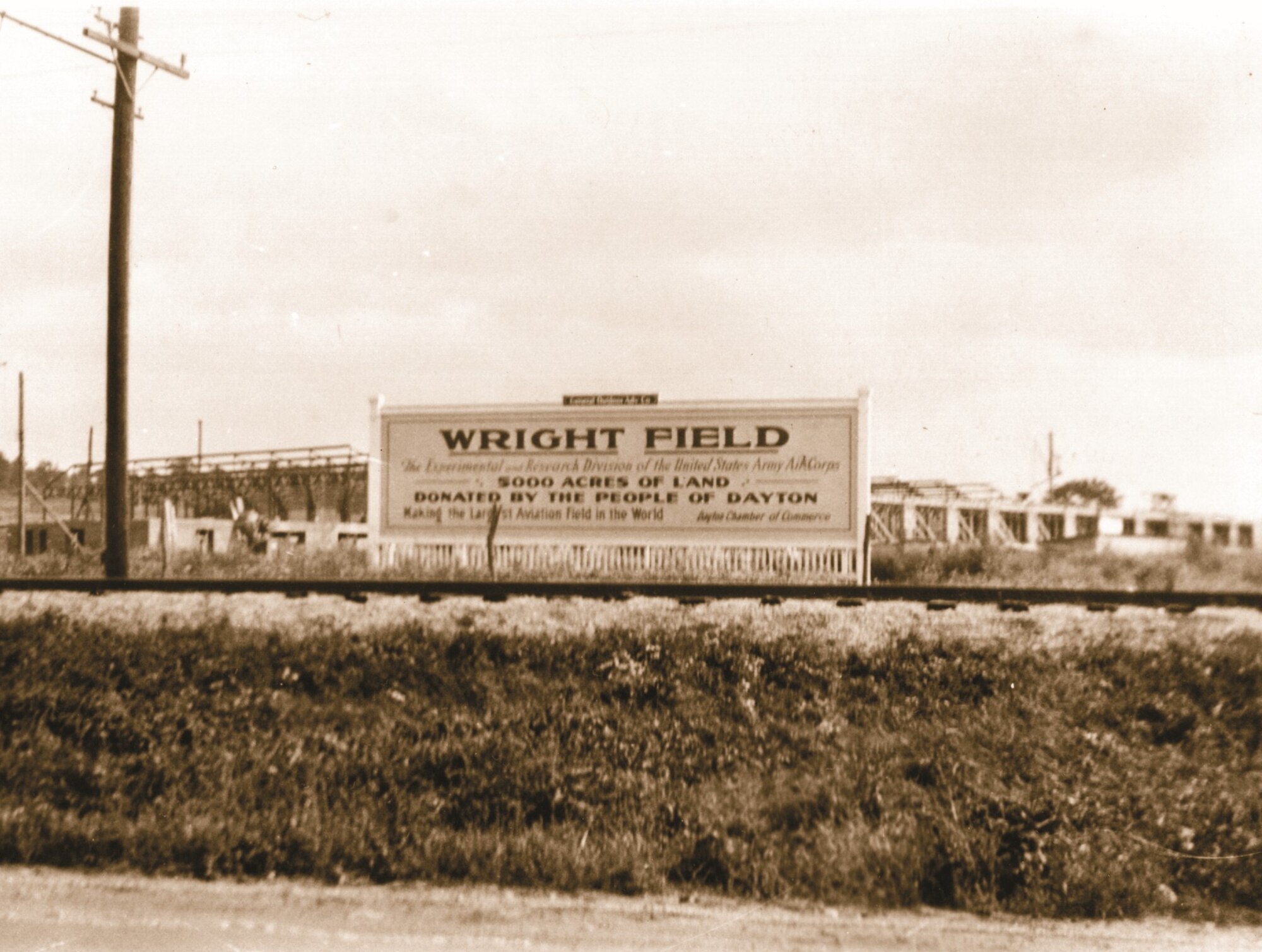 A brown sign showing the land that was proudly donated by the people of Dayton of over 5,000 acres.