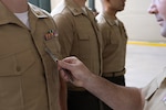 A major in the U.S. Marine Corps is inspected during a uniform inspection at Marine Corps Support Facility New Orleans, April 10, 2026. U.S. Marine Corps Education Command has launched the official Marine Corps Uniform App, a free mobile application that provides Marines with convenient, on-the-go access to uniform and grooming guidance, on June 29, 2026.