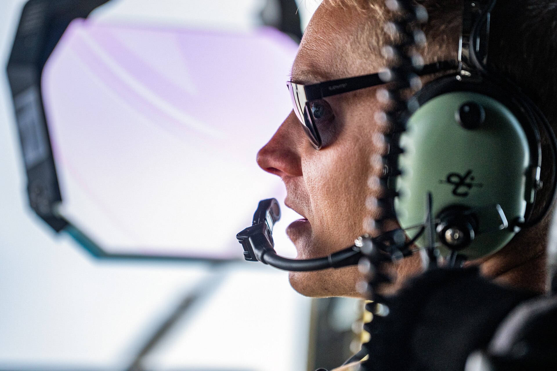 U.S. Air Force Capt. Phil Woods, a pilot assigned to the 123rd Airlift Wing, Kentucky Air National Guard, discusses flying operations with his co-pilot on the flight deck of a C-130J Super Hercules aircraft en route to Esbjerg, Denmark, in support of exercise Ramstein Flag on June 18, 2026. The 123rd AW is providing tactical airlift to NATO Allies throughout the month of June for the Allied Air Command event, a large-scale, multi-location and joint operating area exercise with 18 participating nations and more than 200 aircraft. (U.S. Air National Guard photo by Senior Airman Annaliese Billings)