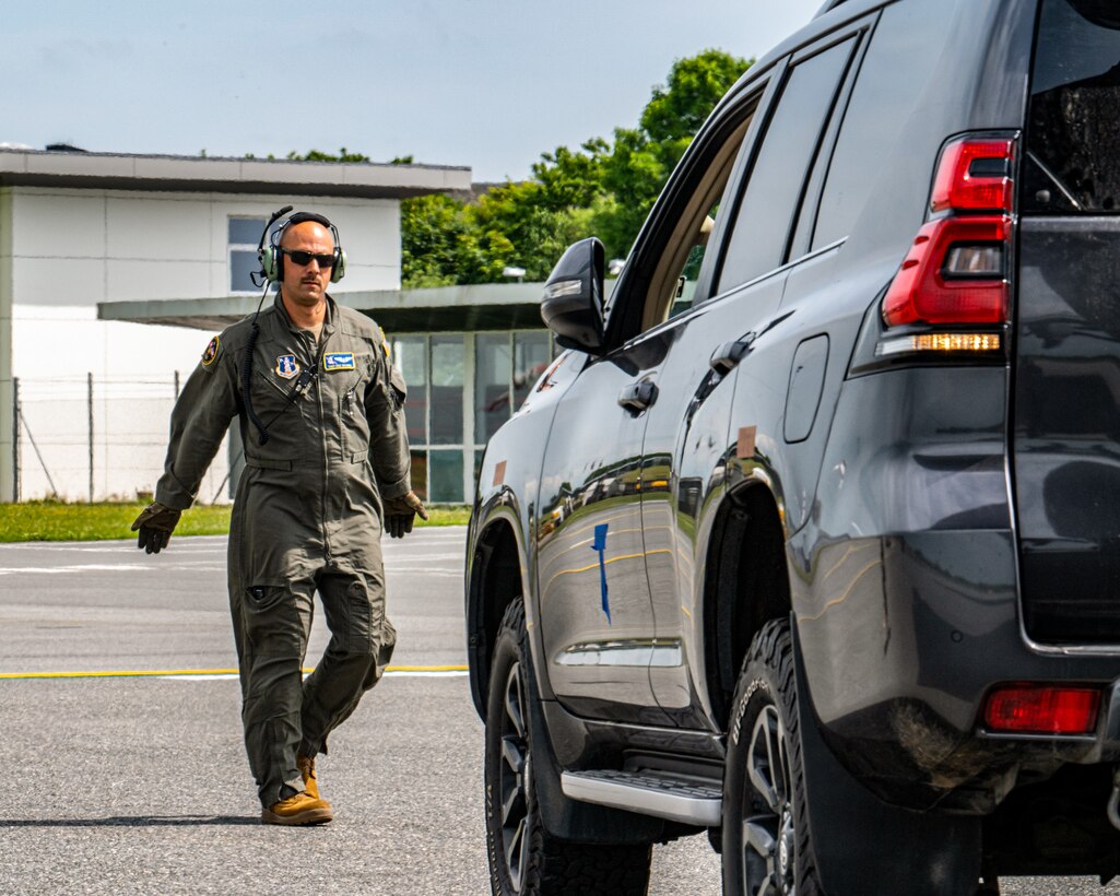 U.S. Air Force Tech. Sgt. Eric Skaggs, a loadmaster assigned to the 123rd Airlift Wing, Kentucky Air National Guard, marshals a vehicle into a C-130J Super Hercules aircraft at Esbjerg Airport in Esbjerb, Denmark, during exercise Ramstein Flag on June 18, 2026. The 123rd AW is providing tactical airlift to NATO Allies throughout the month of June for the Allied Air Command event, a large-scale, multi-location and joint operating area exercise with 18 participating nations and more than 200 aircraft. (U.S. Air National Guard photo by Senior Airman Annaliese Billings)