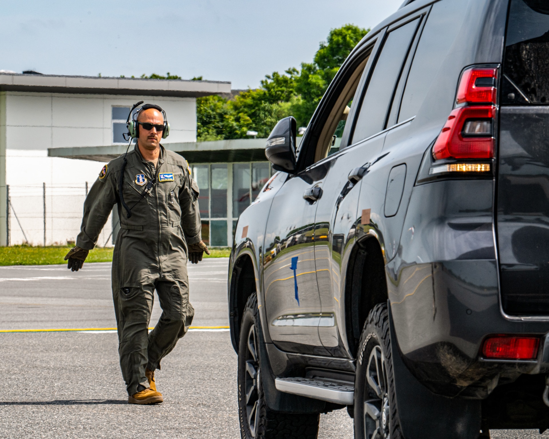 U.S. Air Force Tech. Sgt. Eric Skaggs, a loadmaster assigned to the 123rd Airlift Wing, Kentucky Air National Guard, marshals a vehicle into a C-130J Super Hercules aircraft at Esbjerg Airport in Esbjerb, Denmark, during exercise Ramstein Flag on June 18, 2026. The 123rd AW is providing tactical airlift to NATO Allies throughout the month of June for the Allied Air Command event, a large-scale, multi-location and joint operating area exercise with 18 participating nations and more than 200 aircraft. (U.S. Air National Guard photo by Senior Airman Annaliese Billings)