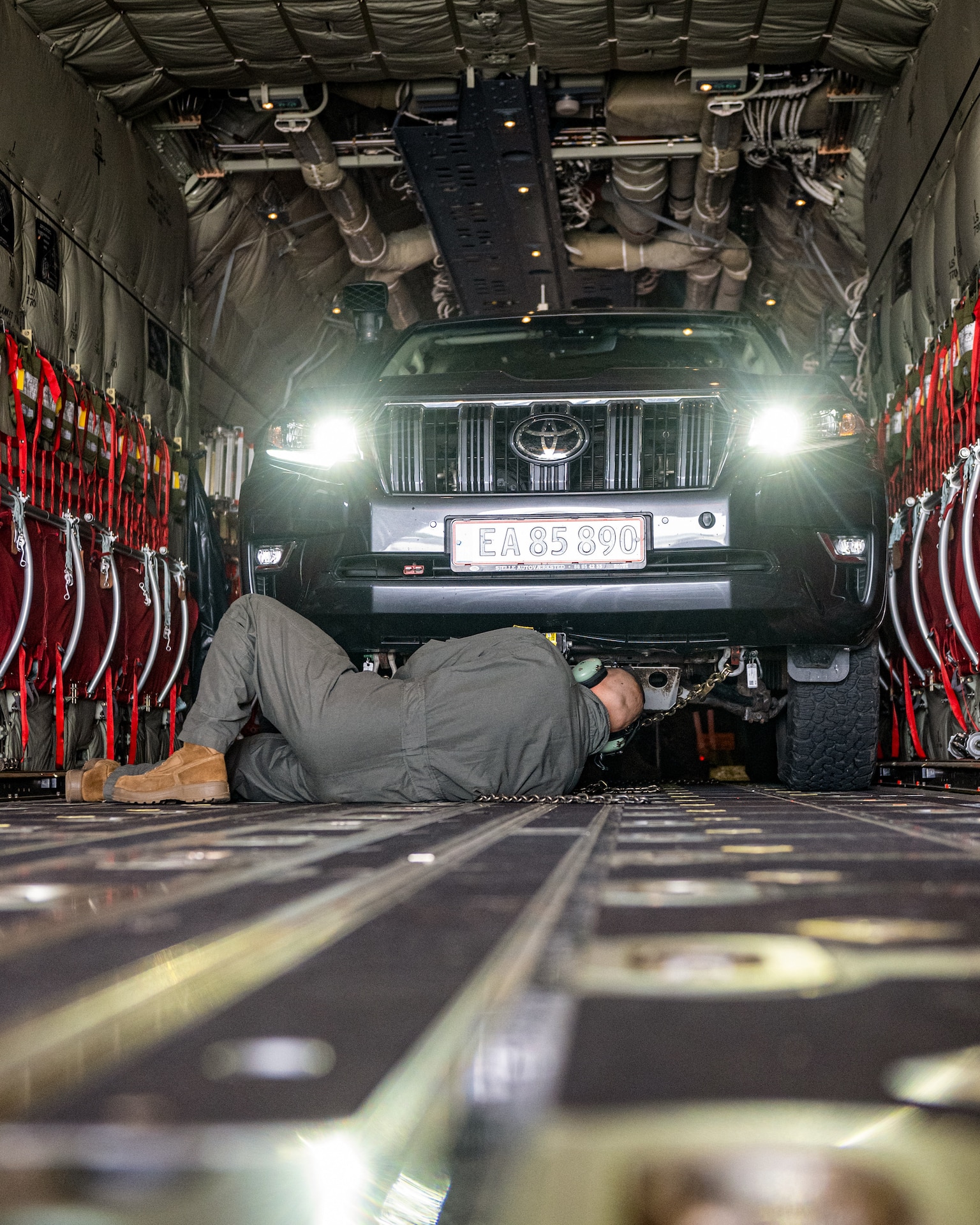 U.S. Air Force Tech. Sgt. Eric Skaggs, a loadmaster assigned to the 123rd Airlift Wing, Kentucky Air National Guard, chains a vehicle to the cargo bay of a C-130J Super Hercules aircraft at Esbjerg Airport, Denmark, during exercise Ramstein Flag on June 18, 2026. The 123rd AW is providing tactical airlift to NATO Allies throughout the month of June for the Allied Air Command event, a large-scale, multi-location and joint operating area exercise with 18 participating nations and more than 200 aircraft. (U.S. Air National Guard photo by Senior Airman Annaliese Billings)