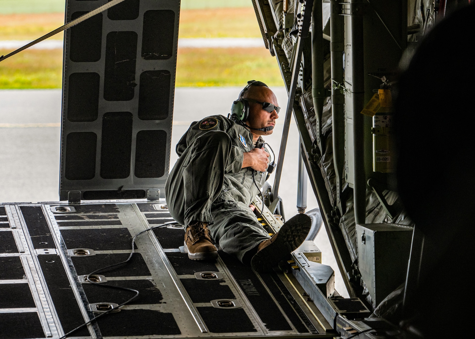 U.S. Air Force Tech. Sgt. Eric Skaggs, a loadmaster assigned to the 123rd Airlift Wing, Kentucky Air National Guard, surveys the ramp after a C-130J Super Hercules lands at Esbjerg Airport, Denmark, during exercise Ramstein Flag on June 18, 2026. The 123rd AW is providing tactical airlift to NATO Allies throughout the month of June for the Allied Air Command event, a large-scale, multi-location and joint operating area exercise with 18 participating nations and more than 200 aircraft. (U.S. Air National Guard photo by Senior Airman Annaliese Billings)
