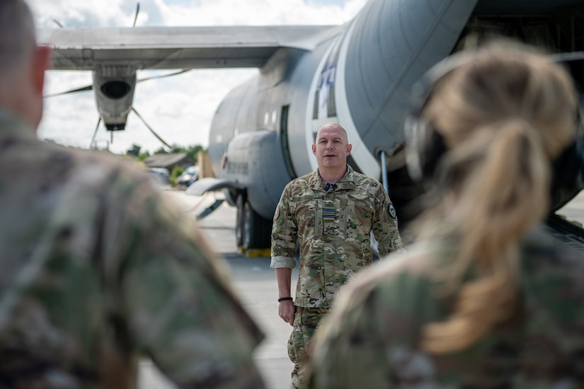 The commander of a Danish Armed Forces Air Mobile Protection and Recovery Flight discusses his unit’s mission in front of a U.S. Air Force C-130J Super Hercules aircraft assigned to the 123rd Airlift Wing, Kentucky National Guard, at Karup Air Base, Denmark, June 18, 2026. Concurrent with Ramstein Flag 2026, the Air National Guard is conducting bilateral training with Danish defense forces, enhancing interoperability and showcasing a unified dedication to deterrence and global peace through strength. (U.S. Air National Guard photo by Senior Airman Annaliese Billings)