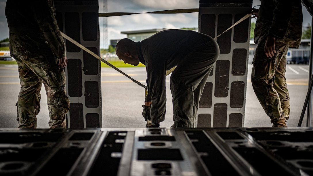 U.S. Air Force Tech. Sgt. Eric Skaggs, a loadmaster assigned to the 123rd Airlift Wing, Kentucky Air National Guard, secures ramp extensions after loading cargo on a C-130J Super Hercules aircraft at Esbjerg, Denmark, during exercise Ramstein Flag on June 18, 2026. The 123rd AW is providing tactical airlift to NATO Allies throughout the month of June for the Allied Air Command event, a large-scale, multi-location and joint operating area exercise with 18 participating nations and more than 200 aircraft. (U.S. Air National Guard photo by Senior Airman Annaliese Billings)
