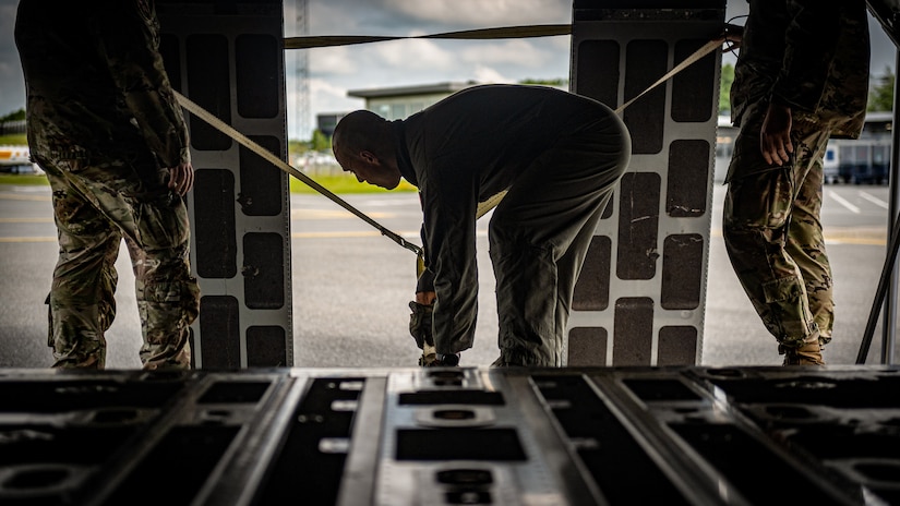 U.S. Air Force Tech. Sgt. Eric Skaggs, a loadmaster assigned to the 123rd Airlift Wing, Kentucky Air National Guard, secures ramp extensions after loading cargo on a C-130J Super Hercules aircraft at Esbjerg, Denmark, during exercise Ramstein Flag on June 18, 2026. The 123rd AW is providing tactical airlift to NATO Allies throughout the month of June for the Allied Air Command event, a large-scale, multi-location and joint operating area exercise with 18 participating nations and more than 200 aircraft. (U.S. Air National Guard photo by Senior Airman Annaliese Billings)