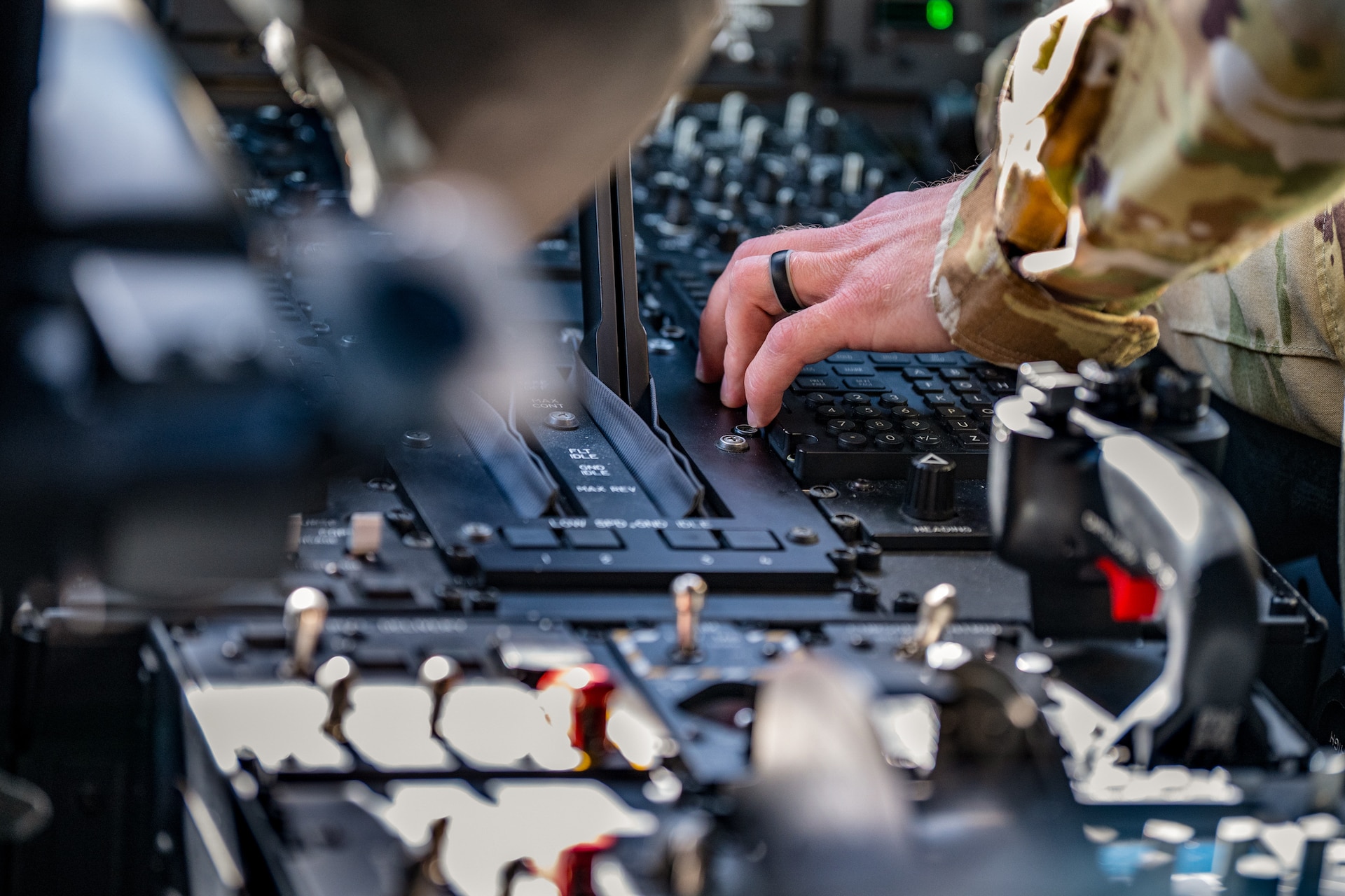 U.S. Air Force Capt. Phil Woods, a pilot assigned to the 123rd Airlift Wing, Kentucky Air National Guard, adjusts the controls of a C-130J Super Hercules aircraft during an airlift mission to Esbjerg, Denmark, in support of exercise Ramstein Flag on June 18, 2026. The 123rd AW is providing tactical airlift to NATO Allies throughout the month of June for the Allied Air Command event, a large-scale, multi-location and joint operating area exercise with 18 participating nations and more than 200 aircraft. (U.S. Air National Guard photo by Senior Airman Annaliese Billings)