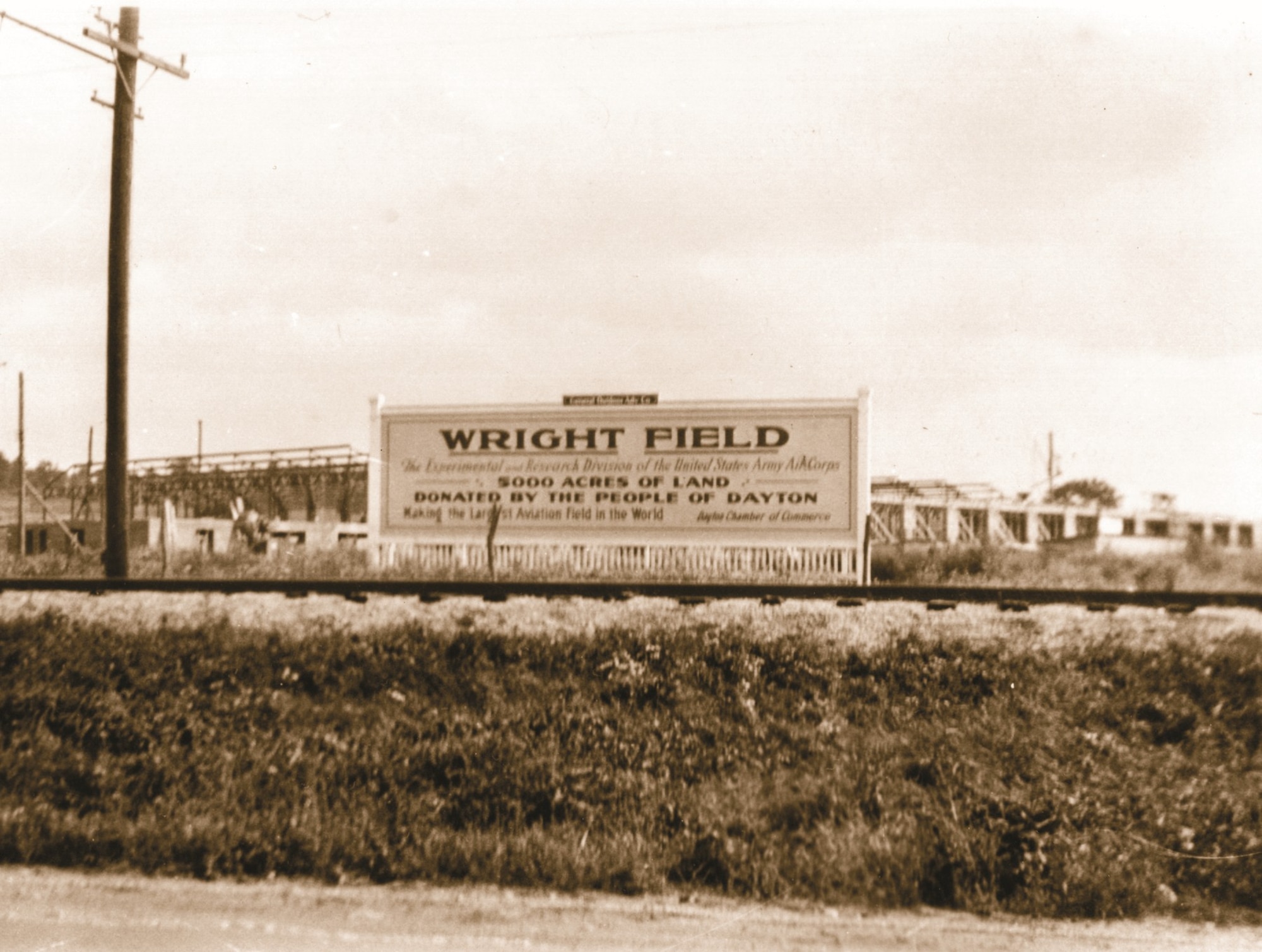 A brown sign showing the land that was proudly donated by the people of Dayton of over 5,000 acres.