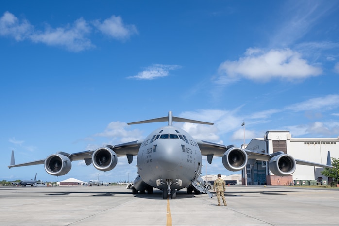 U.S. Air Force Airman 1st Class Nathan Gooding, 535th Airlift Squadron loadmaster, inspects a C-17 Globemaster III prior to takeoff.