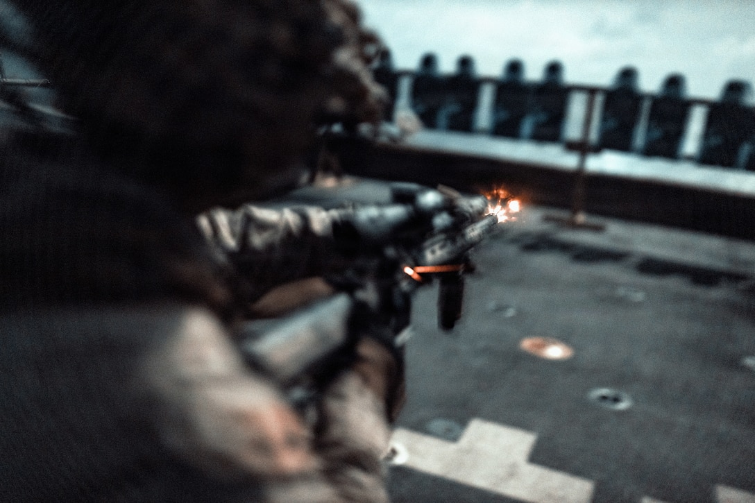 A U.S. Marine with Battalion Landing Team 3/5, 11th Marine Expeditionary Unit, fires an M27 infantry automatic rifle on the flight deck of San Antonio-class amphibious transport dock ship USS Portland (LPD 27) during marksmanship training in the Indian Ocean, June 26, 2026. The 11th MEU, embarked aboard the Boxer Amphibious Ready Group, is a persistent, combat credible force contributing to deterrence and crisis response in the U.S. 7th Fleet area of operations. U.S. 7th Fleet, the U.S. Navy’s largest forward-deployed numbered fleet, routinely interacts and operates with allies and partners to preserve a free and open Indo-Pacific. (U.S. Marine Corps photo by Lance Cpl. Luke Rodriguez)