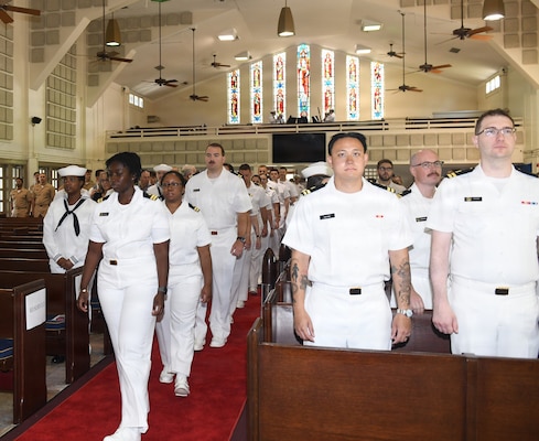 260630-N-JB216-2618 Jacksonville, Fla. (June 30, 2026) Naval Hospital (NH) Jacksonville Family Medicine interns march in during their graduation ceremony held at All Saints Chapel on June 30, onboard Naval Air Station Jacksonville. Twenty-nine physicians are the latest graduates of NH Jacksonville’s award-winning Family Medicine Residency Program, which is currently celebrating its 56th year of continuous accreditation. (U.S. Navy photo by Kie Savage, Naval Hospital Jacksonville/Released).