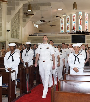 260630-N-JB216-6760 Jacksonville, Fla. (June 30, 2026) Naval Hospital Jacksonville Family Medicine residents lead the march in during their graduation ceremony held at All Saints Chapel on June 30, aboard Naval Air Station Jacksonville. Twenty-nine physicians are the latest graduates of NH Jacksonville’s award-winning Family Medicine Residency Program, which is currently celebrating its 56th year of continuous accreditation. (U.S. Navy photo by Kie Savage, Naval Hospital Jacksonville/Released).