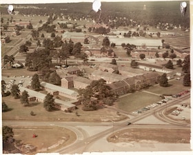 An aerial view of the original Naval Hospital Cherry Point complex, photographed July 26, 1968. The hospital was formally commissioned at 11 a.m. on July 1, 1968, with Navy Capt. Anthony Rush serving as its first commander. Fifty-eight years later, Sailors and civilians serving at Naval Health Clinic Cherry Point and Navy Medicine Readiness and Training Command Cherry Point honor the legacy of the original staff by continuing their mission of keeping MCAS Cherry Point’s service members medically ready for deployment while caring for their family members.
