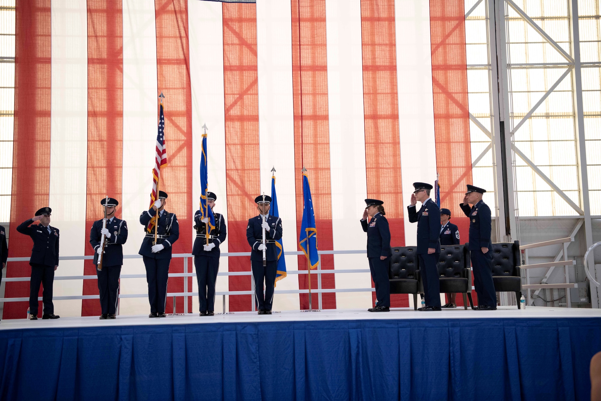 Members of the Blue Eagles Honor Guard present the colors during the Air Force Test Center change-of-command ceremony at Edwards Air Force Base, California, June 30, 2026. The event marked the beginning of a leadership transition as Maj. Gen. Scott Cain, outgoing commander of AFTC, prepares to relinquish command to Brig. Gen. Mark Massaro, incoming commander of AFTC. (U.S. Air Force photo by Master Sgt. Tabatha Arellano)