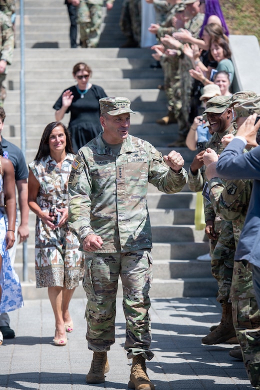 U.S. Army Gen. Christopher Donahue greets the crowd after descending the steps of the Mission Command Center, arriving to  his relinquishment of command ceremony July 2, 2026, at Clay Kaserne in Wiesbaden, Germany. During his tenure, Donahue led efforts to develop and scale the Eastern Flank Deterrence Initiative, a transformational warfighting concept designed to integrate land forces in support of NATO's regional defense plans. (U.S. Army photo by Susanne Goebel)