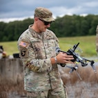 Staff Sgt. Alexander Spradling, an instructor with the 1-117th Military Police Battalion’s Multifunction Company prepares to launch an RQ-28A, a small, unmanned aircraft during the Small Unmanned Aircraft System, or SUAS, Master Trainer pilot course at Tullahoma’s Volunteer Training Site, June 23, 2026.