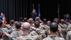 Lt. Col. Mason Workman renders his first salute to the GXS squadron during a change of command ceremony.