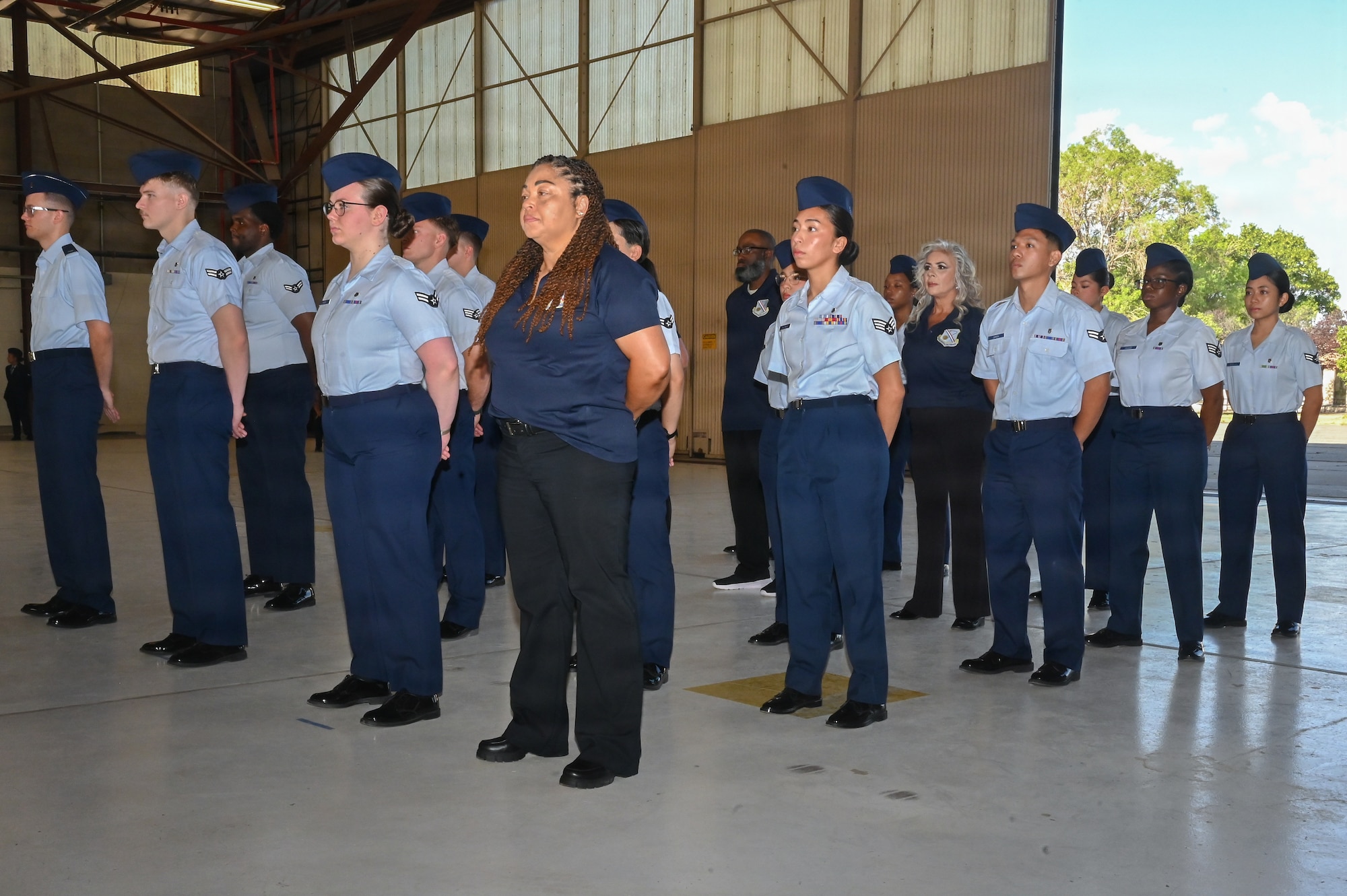 Members from the Kirtland Medical Group stand at parade rest for U.S. Air Force Col. Cody J. Hess, incoming Kirtland Medical Group commander during the change of command ceremony at Kirtland Air Force Base.