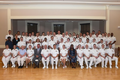 The Naval Medical Center Camp Lejeune Graduate Medical Education Directorate is pictured at the Family Medicine Residency and Sports Medicine Fellowship graduation ceremony on June 30, 2026. The program graduated 10 family medicine residents, 12 family medicine interns, and two sports medicine fellows for Navy Medicine.