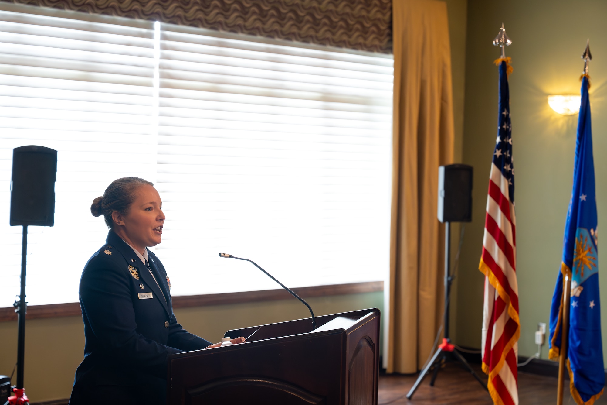 Lt. Col. Cara Treadwell delivers her first address as the new commander of the Integrated Command, Control, Communications, Computers, Intelligence, Surveillance, and Reconnaissance Analysis Squadron during a change of command ceremony at Wright-Patterson Air Force Base, Ohio, June 29, 2026. During her remarks, Treadwell outlined her vision for the squadron's mission of delivering critical intelligence on adversary networks and capabilities. (U.S. Air Force photo by Staff Sgt. Kristof J. Rixmann)