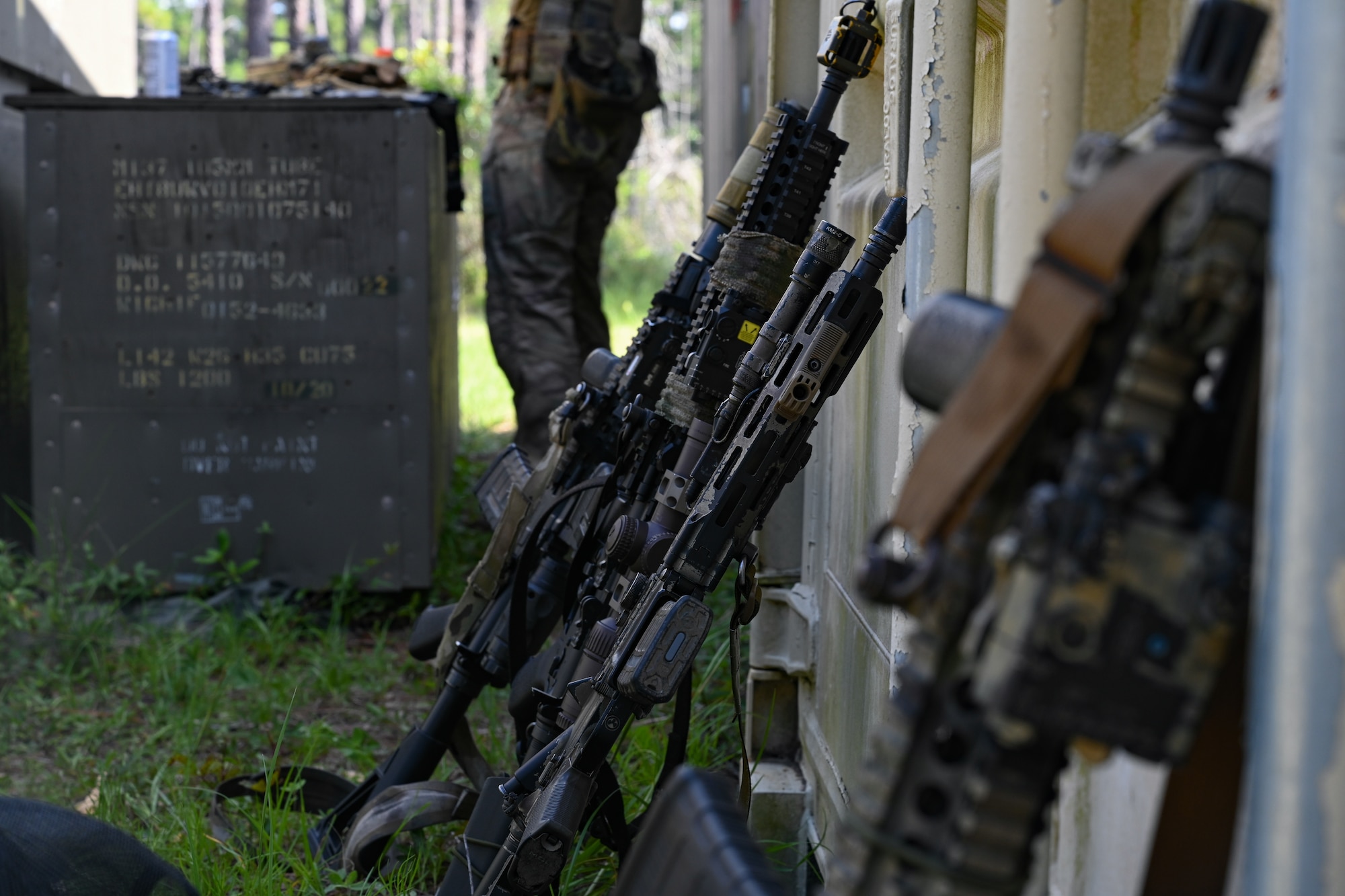 Weapons are propped against a wall for close-quarters battle training during exercise Emerald Warrior Spiral at Hurlburt Field, Florida, June 8, 2026.