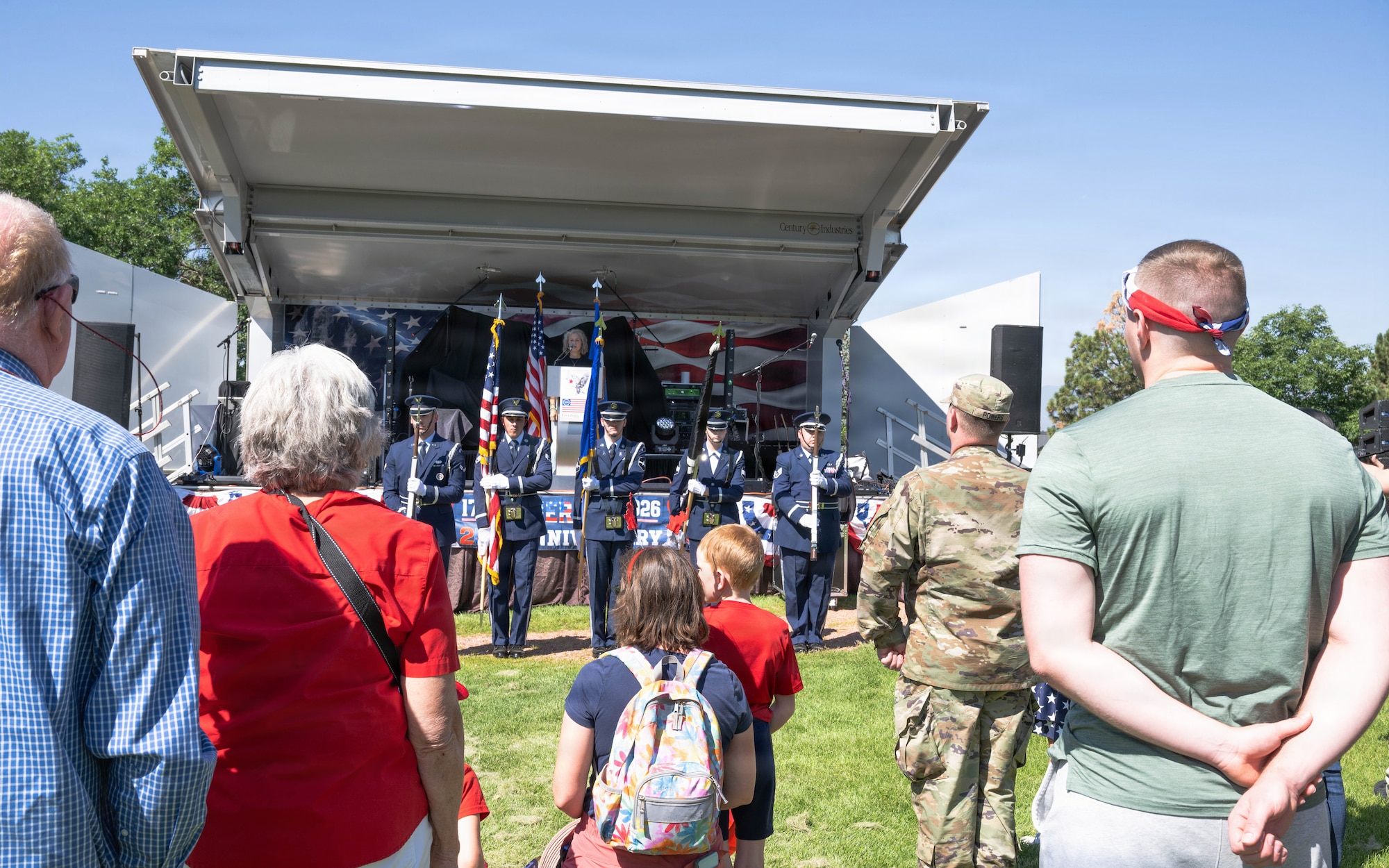 Attendees observe the National Anthem during the opening ceremony at the Freedom 250 Independence Day Celebration at Peterson Space Force Base.