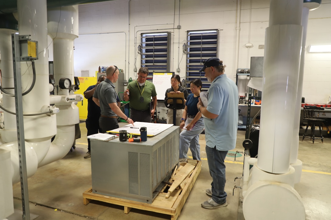 Practicum Instructor Brian Clark, research mechanical engineer at the U.S. Army Engineer Research and Development Center’s Construction Engineer Research Laboratory (ERDC-CERL), leads a session in system diagramming in the ERDC-CERL Central Utility Plant.