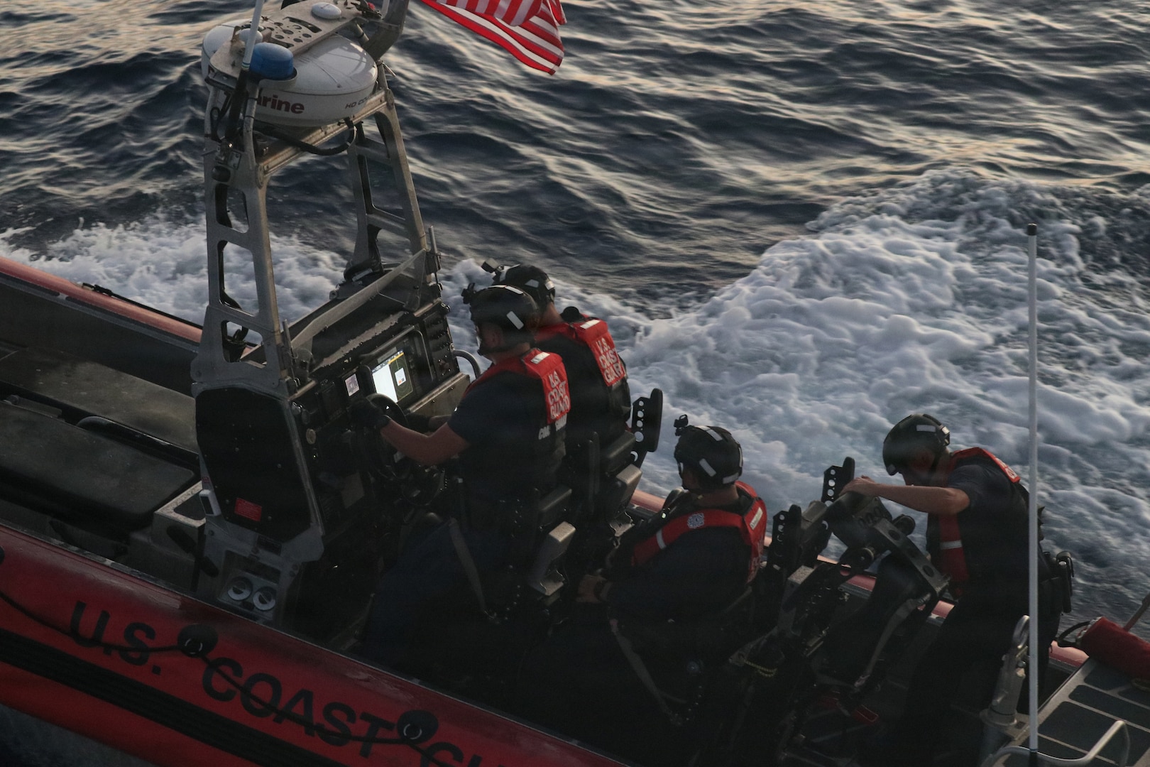 A small boat crew from the Coast Guard Cutter Bear (WMEC 901) launches to intercept a suspected drug-smuggling vessel in the Southern Caribbean Sea, April 28, 2026. The Bear's crew patrolled the region as part of a joint effort with international partners to interdict illicit narcotics trafficking. (U.S. Coast Guard photo)