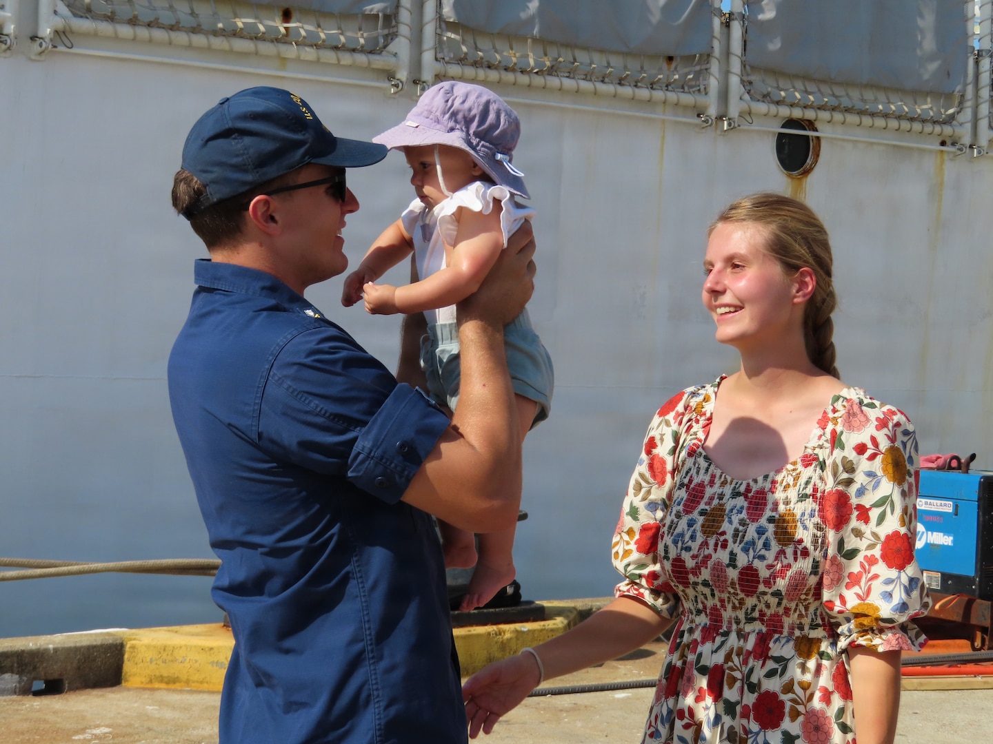 A U.S. Coast Guard member attached to Coast Guard Cutter Bear (WMEC 901) greets their family in Portsmouth, Virginia June 30, 2026. The Bear's crew deployed in support of Joint Interagency Task Force - South and conducted counter-drug missions in the Eastern Pacific. (U.S. Coast Guard photo)