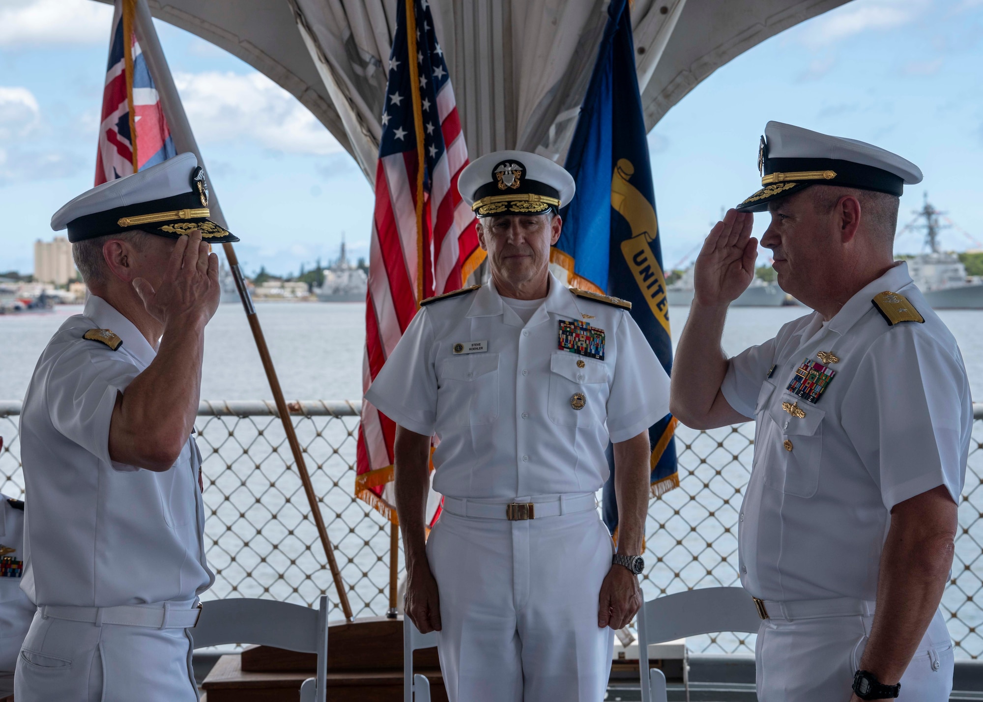 U.S. Navy Adm. Steve Koehler, commander, U.S. Pacific Fleet, center, observes Rear Adm. Kurt Mole, incoming commander, Fleet Information Warfare Command – Pacific (FIWCPAC), right, relieve Rear Adm. Nicholas Homan, outgoing commander, FIWCPAC, left, during the FIWCPAC change of command ceremony aboard the Battleship Missouri Memorial on Joint Base Pearl Harbor-Hickam, Hawaii, July 2, 2026. Established in 2022, FIWCPAC’s mission is to plan, coordinate, and direct information-related capabilities and effects within the region that support tactical and operational actions across the joint force. (U.S. Navy photo by Mass Communication Specialist 2nd Class Christopher Sypert)