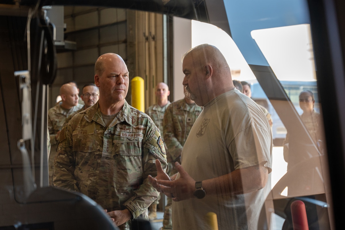 U.S. Air Force Gen. S.L. Davis, left, commander of Air Force Global Strike Command, receives a briefing from Mark Bean, 377th Test Support Squadron range operations manager, at Kirtland Air Force Base, New Mexico, June 17, 2026. Bean briefed Davis about the state-of-the-art equipment used to patrol and maintain the installation's more than 50,000 acres of wilderness area that supports various Team Kirtland mission partners, ensuring wildlife safety and environmental stewardship. (U.S. Air Force photo by Senior Airman Donnell Schroeter)