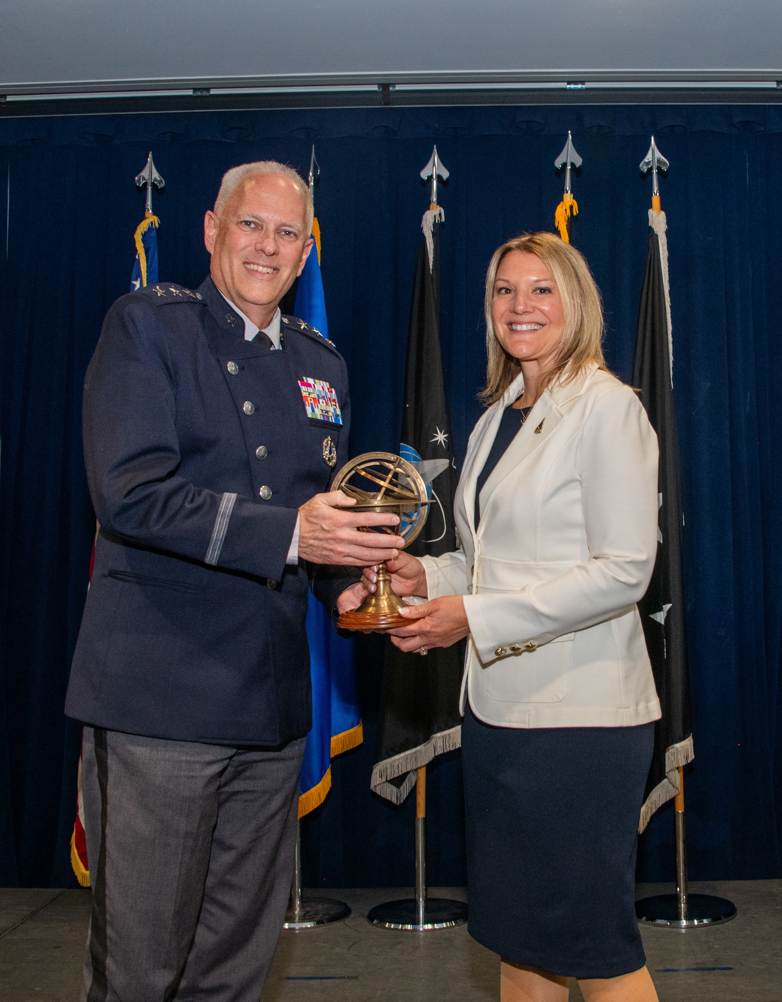 Natalie Riedel, Space Systems Command (SSC) executive director and member of the Senior Executive Service (right) assumes leadership from Lt. Gen. Philip Garrant, SSC commander, at her assumption ceremony in April 2026