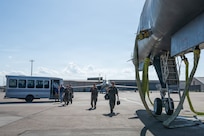 Airmen walk on the flightline