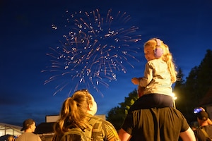 USAG BAVARIA - HOHENFELS, Germany -- An Army Family watches the fireworks during the opening ceremony of the 52nd annual German-American Volksfest July 3, 2026, which celebrated both the 250th anniversary of the United States of America as well as the 75th anniversary of the expansion of the Army training area at Hohenfels. (U.S. Army photo by Bryan Gatchell, USAG Bavaria Public Affairs)