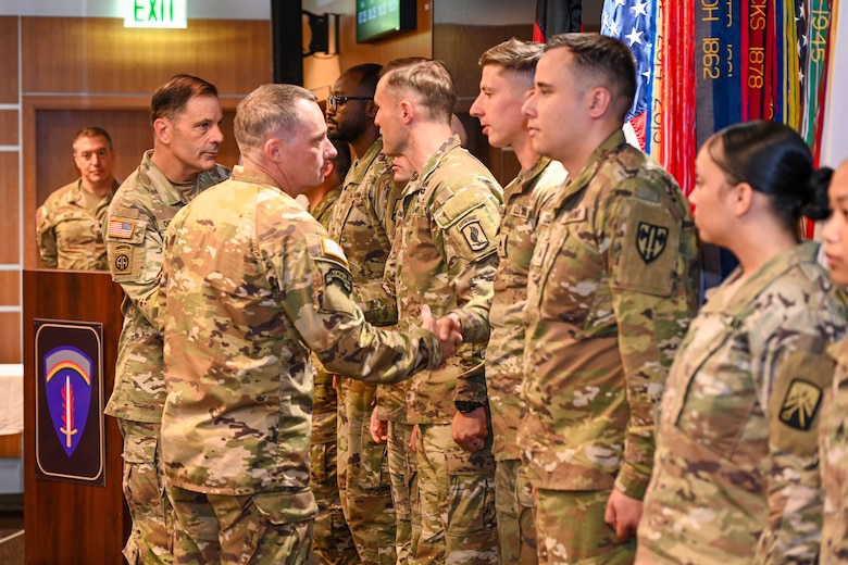 Gen. Christopher Donahue, commanding general of U.S. Army Europe and Africa, congratulates Soldiers from the 515th Transportation Company during an award ceremony in Wiesbaden, Germany, June 12, 2026. The Baumholder-based "Roadrunners" earned the prestigious Army Award for Maintenance Excellence "Best of the Best" Award for fiscal year 2025, recognizing them as the top maintenance company in the entire U.S. Army for their critical role in enabling readiness and supporting NATO allies. (U.S. Army photo by Mr. Nathaniel Petraitis)