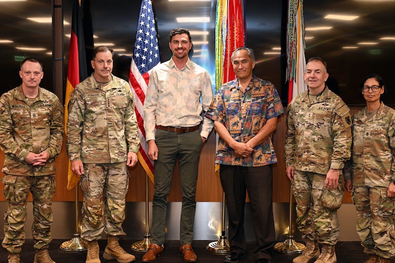 From left, Command Sgt. Maj. Mullinax; Gen. Christopher Donahue, commanding general of U.S. Army Europe and Africa; Mr. Brian Motyl; Mr. Mike Tillemas; Command Sgt. Maj. Giancarlo F. Lalor, USAREUR-AF senior enlisted leader; and Command Sgt. Maj. Malave, pose for a group photo during an awards ceremony in Wiesbaden, Germany, June 12, 2026. Motyl and Tillemas accepted the 2026 Secretary of the Army Environmental Award for Environmental Quality on behalf of the USAREUR-AF Environmental Branch, which earned the Army’s highest honor for environmental achievement. (U.S. Army photo by Mr. Nathaniel Petraitis)