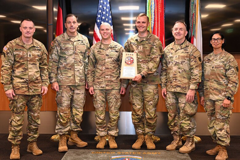 From left, Command Sgt. Maj. Mullinax; Gen. Christopher Donahue, commanding general of U.S. Army Europe and Africa; Capt. Abell; Capt. Cavinder; Command Sgt. Maj. Giancarlo F. Lalor, USAREUR-AF senior enlisted leader; and Command Sgt. Maj. Malave, pose for a photo after the 515th Transportation Company was presented a Logistics Excellence Award in the Maintenance category during a ceremony in Wiesbaden, Germany, June 12, 2026. The unit was recognized as a theater-level winner for their outstanding contributions to sustainment and readiness. (U.S. Army photo by Mr. Nathaniel Petraitis)
