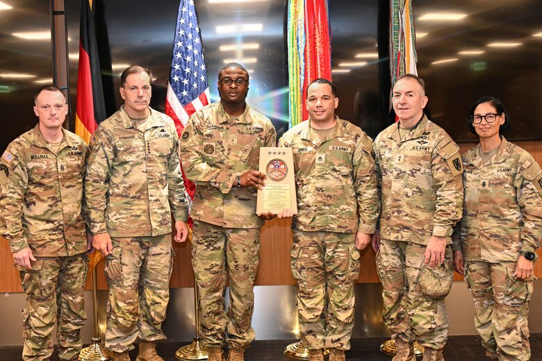 From left, Col. Michael S. Mullinax, U.S. Army Europe and Africa Deputy Chief of Staff, G-4; Gen. Christopher Donahue, commanding general of U.S. Army Europe and Africa; Staff Sgt. Granger; Staff Sgt. Jones; Command Sgt. Maj. Giancarlo F. Lalor, USAREUR-AF senior enlisted leader; and an unidentified Command Sergeant Major, pose for a photo after the 2nd Battalion, 503rd Infantry Regiment (Airborne) was presented a Logistics Excellence Award in Wiesbaden, Germany, June 12, 2026. The 2-503rd IN BN (Airborne) was recognized as a theater-level winner in the fiscal year 2025 Chief of Staff of the Army's Logistics Excellence Awards program for their superior performance in the 'Deployment' category. (U.S. Army photo by Mr. Nathaniel Petraitis)